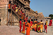 The main temple, in front an open pavilion shelters a huge monolithic Nandi. Pilgrims visiting the temple. 
